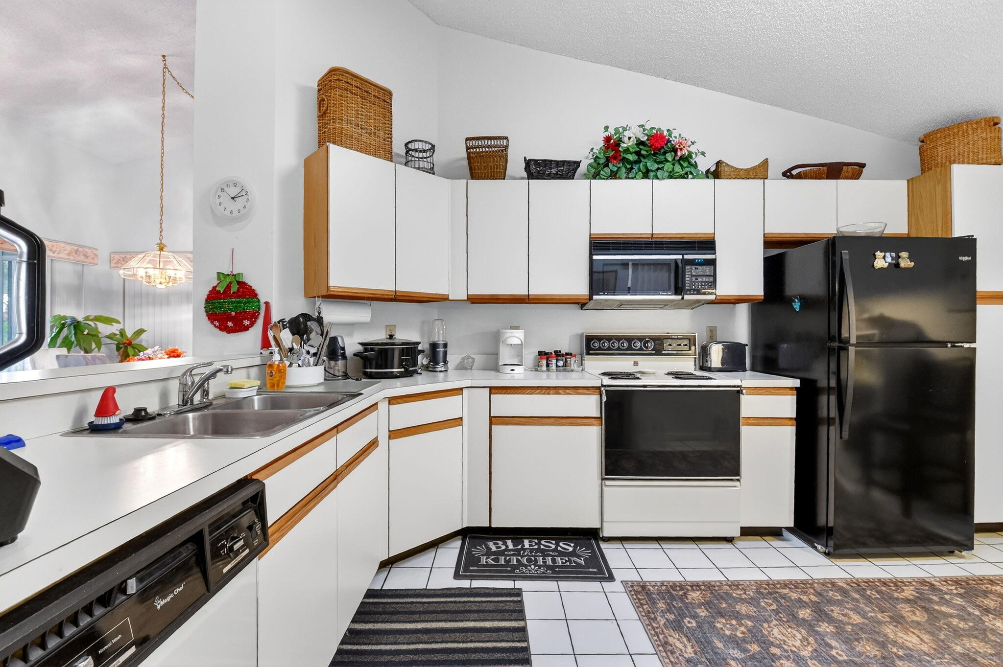 3227 Perimeter Drive Greenacres, FL 33467 - Photo 17 of 57 a kitchen with a sink stove and refrigerator