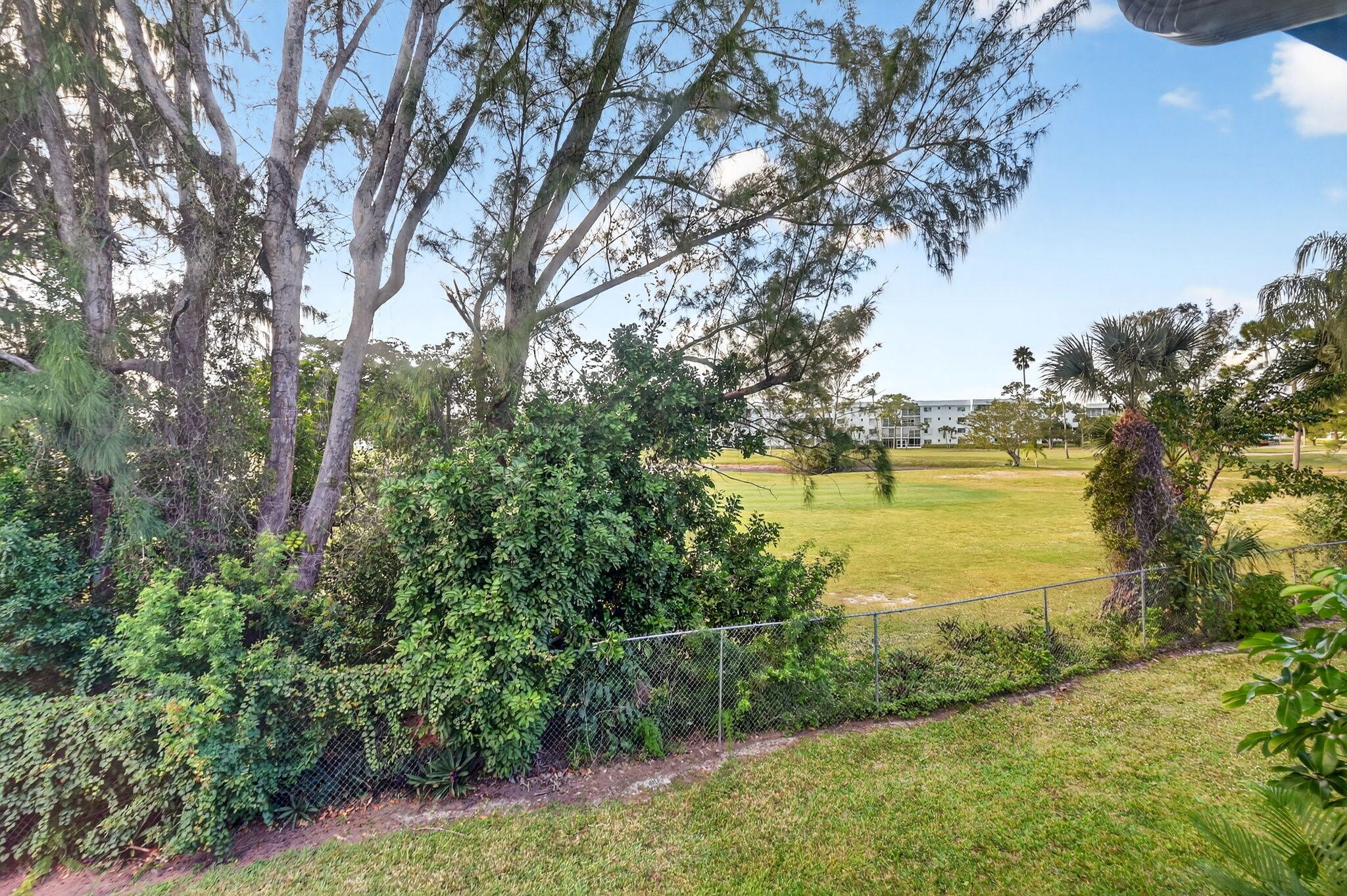 3227 Perimeter Drive Greenacres, FL 33467 - Photo 25 of 57 a view of a lake with a yard and mountain view