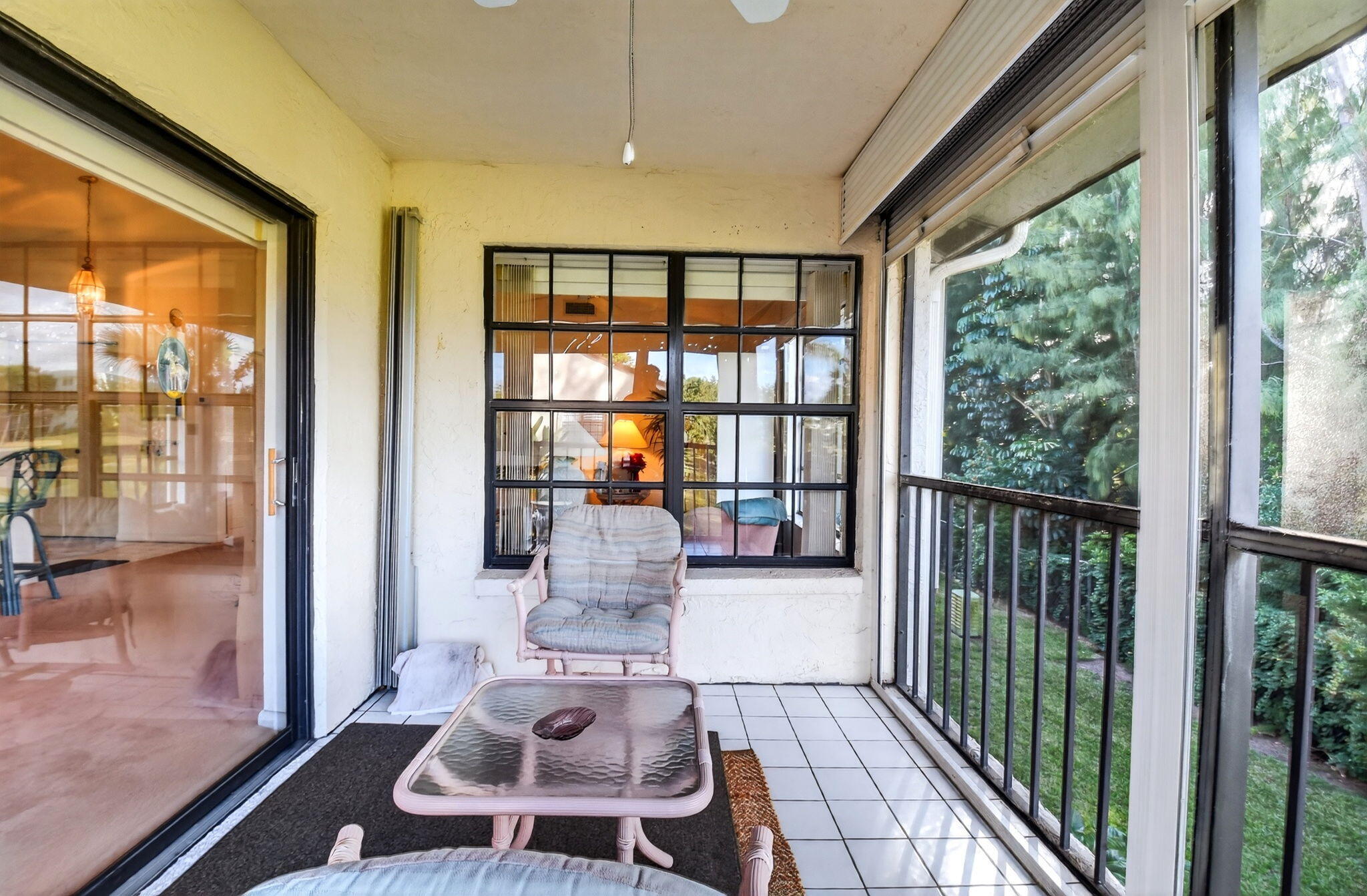 3227 Perimeter Drive Greenacres, FL 33467 - Photo 26 of 57 a living room with furniture and a floor to ceiling window