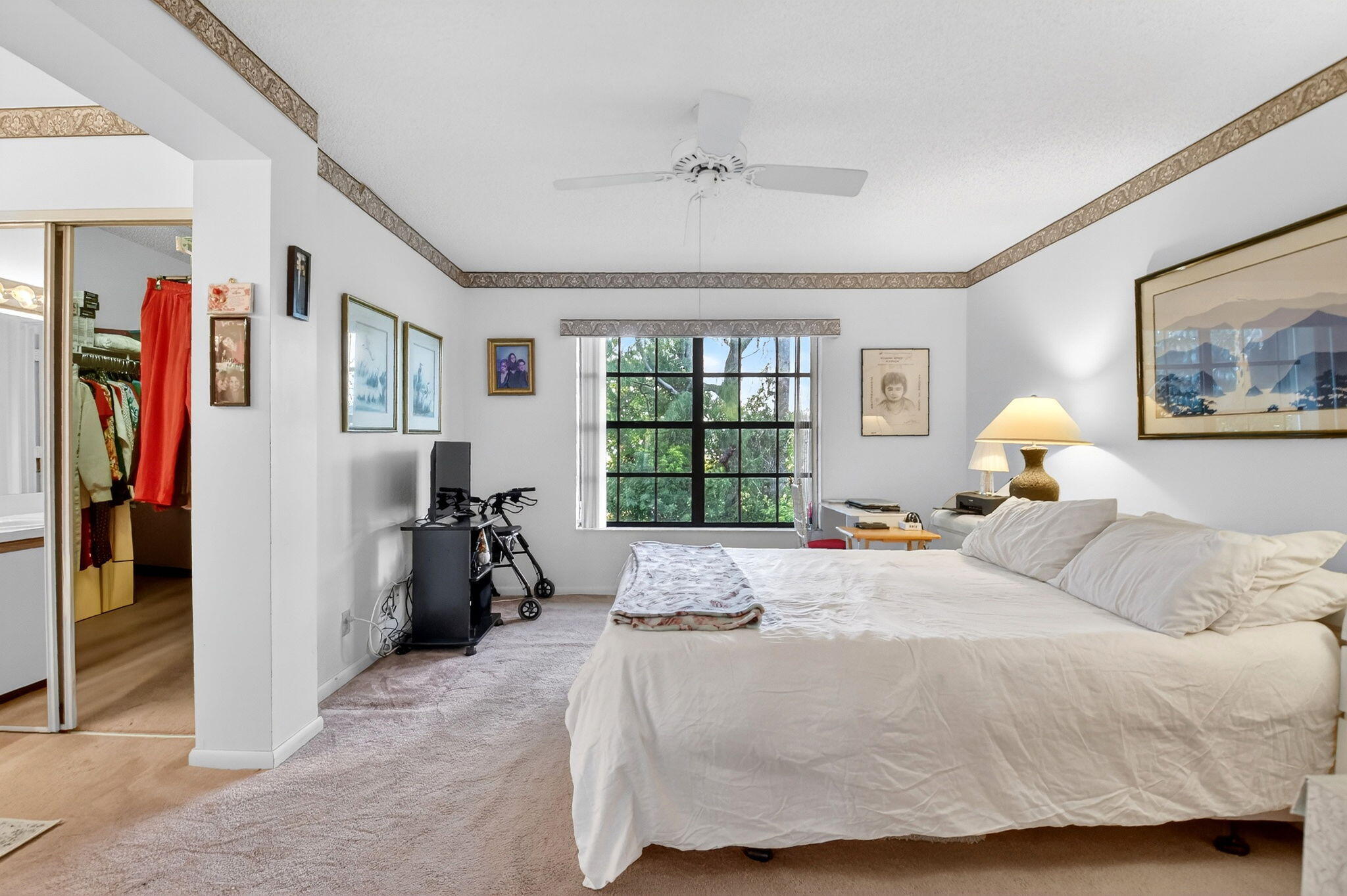 3227 Perimeter Drive Greenacres, FL 33467 - Photo 28 of 57 a bedroom with a bed and a large window