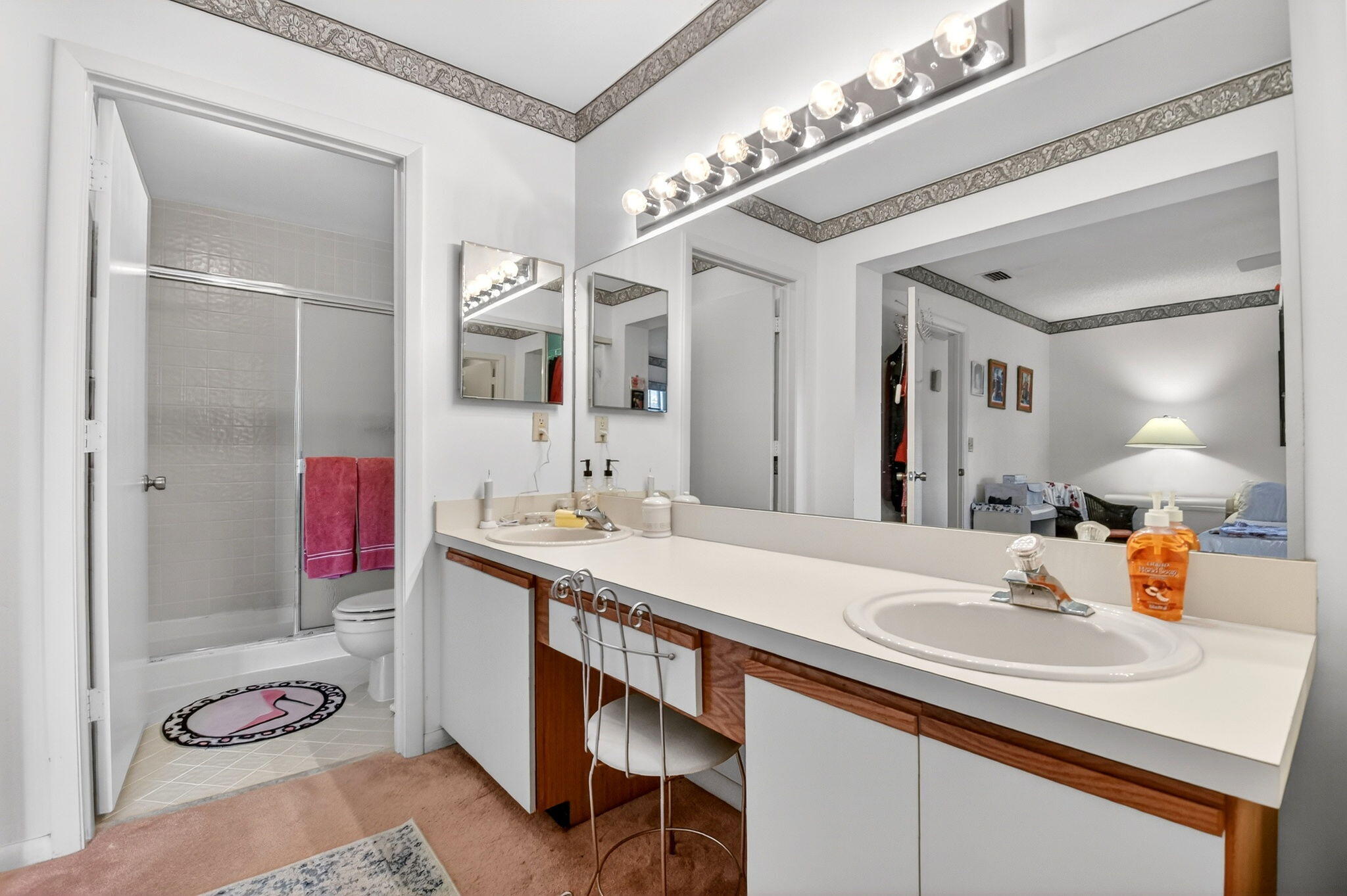 3227 Perimeter Drive Greenacres, FL 33467 - Photo 32 of 57 a bathroom with a sink and a mirror