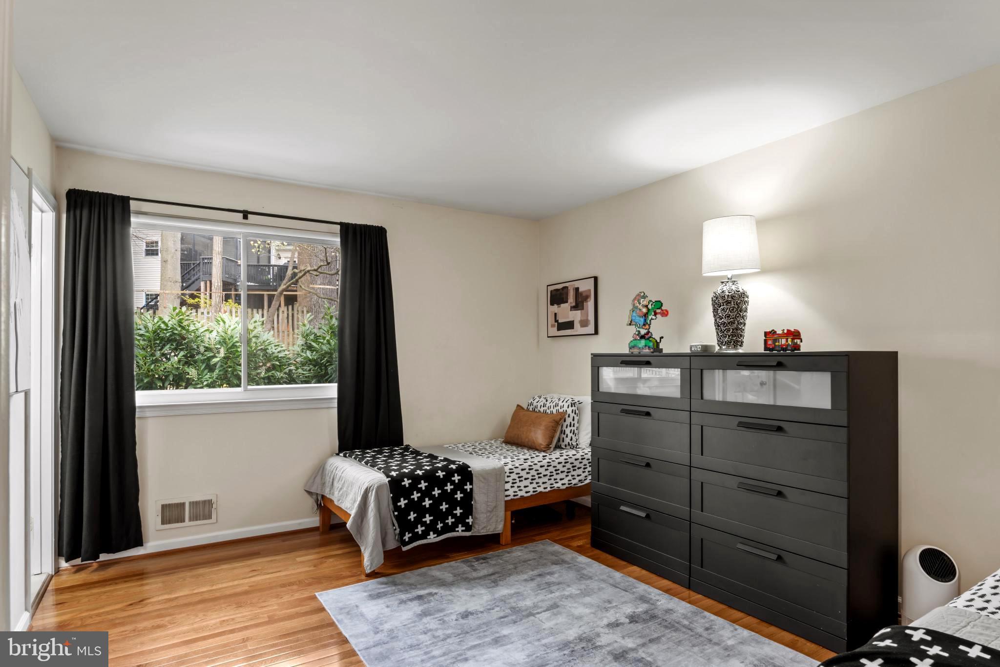 9013 Brook Ford Road Burke, VA 22015 - Photo 12 of 28 a bedroom with a bed and wooden floor