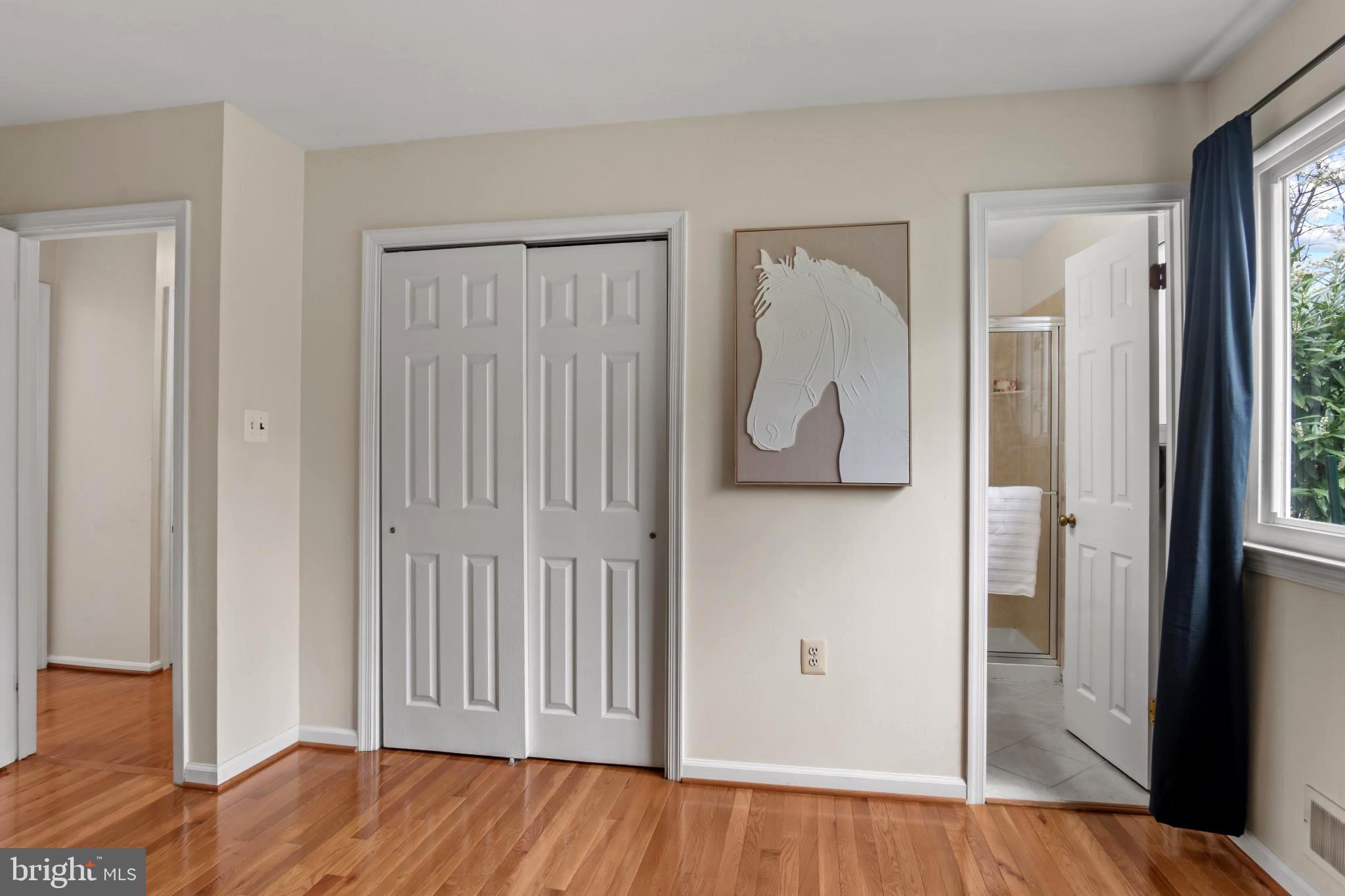 9013 Brook Ford Road Burke, VA 22015 - Photo 13 of 28 a view of a room with wooden floor and stairs