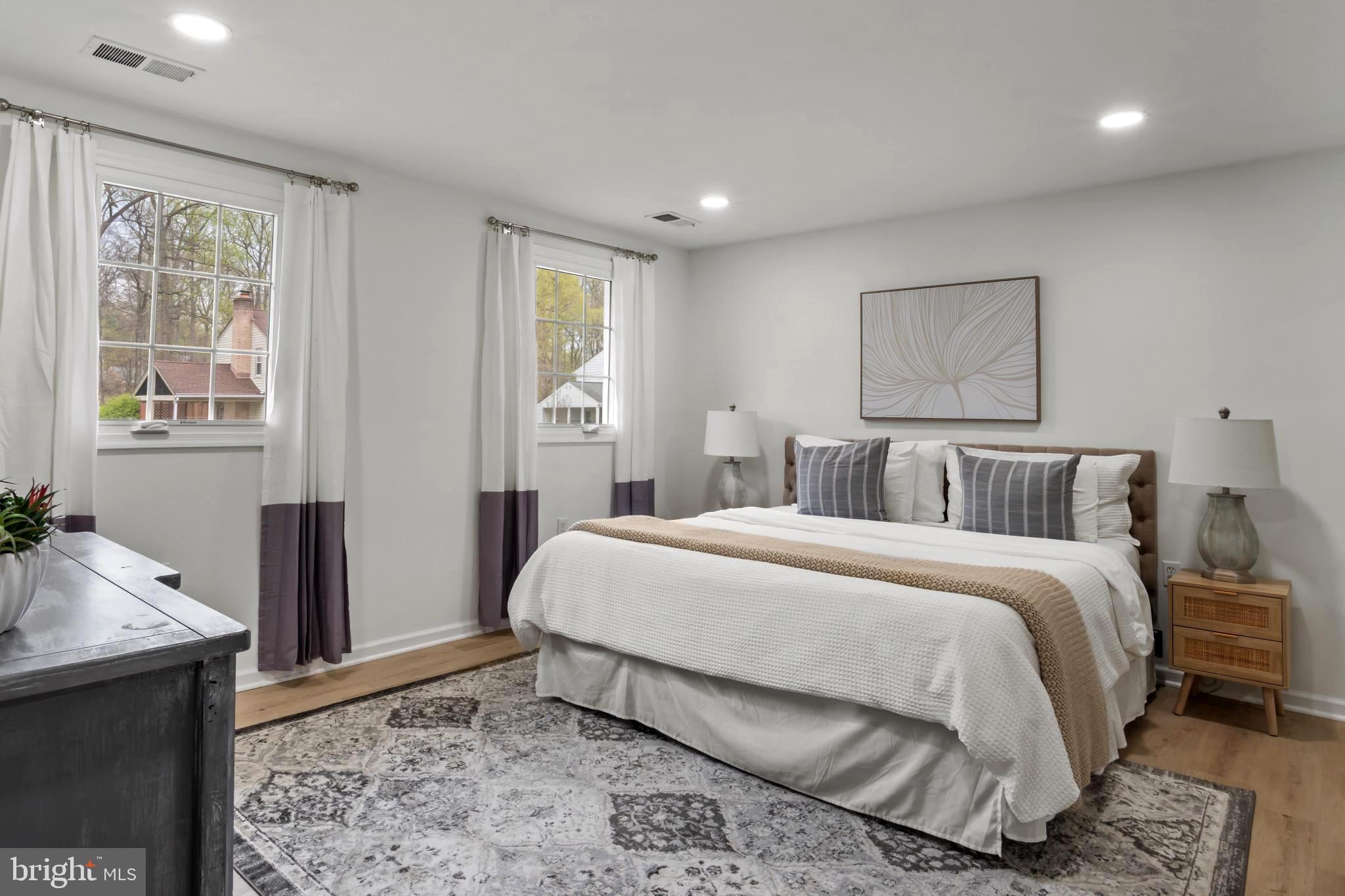 9013 Brook Ford Road Burke, VA 22015 - Photo 17 of 28 a bedroom with a bed and wooden floor