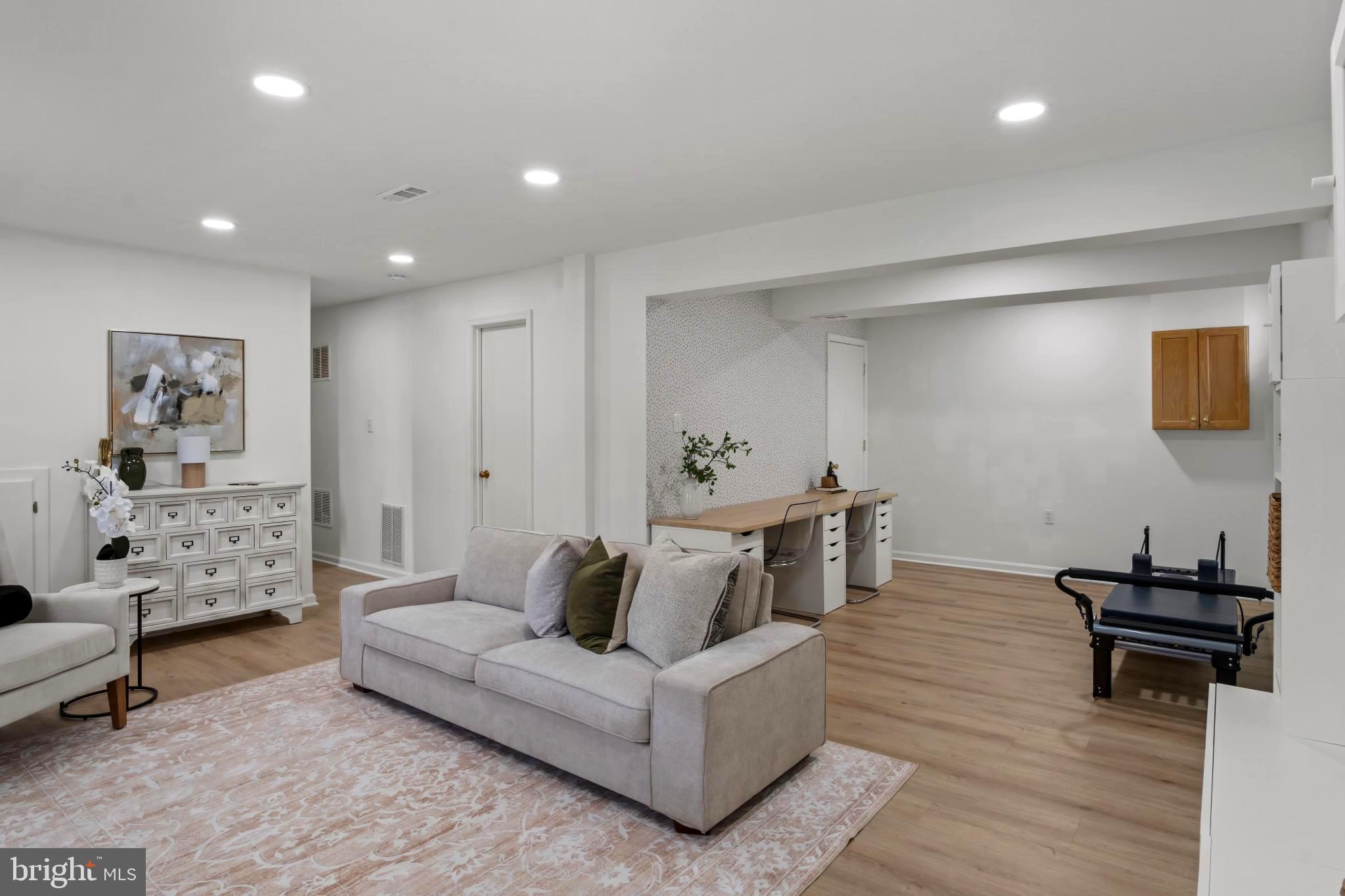 9013 Brook Ford Road Burke, VA 22015 - Photo 21 of 28 a living room with furniture and a wooden floor