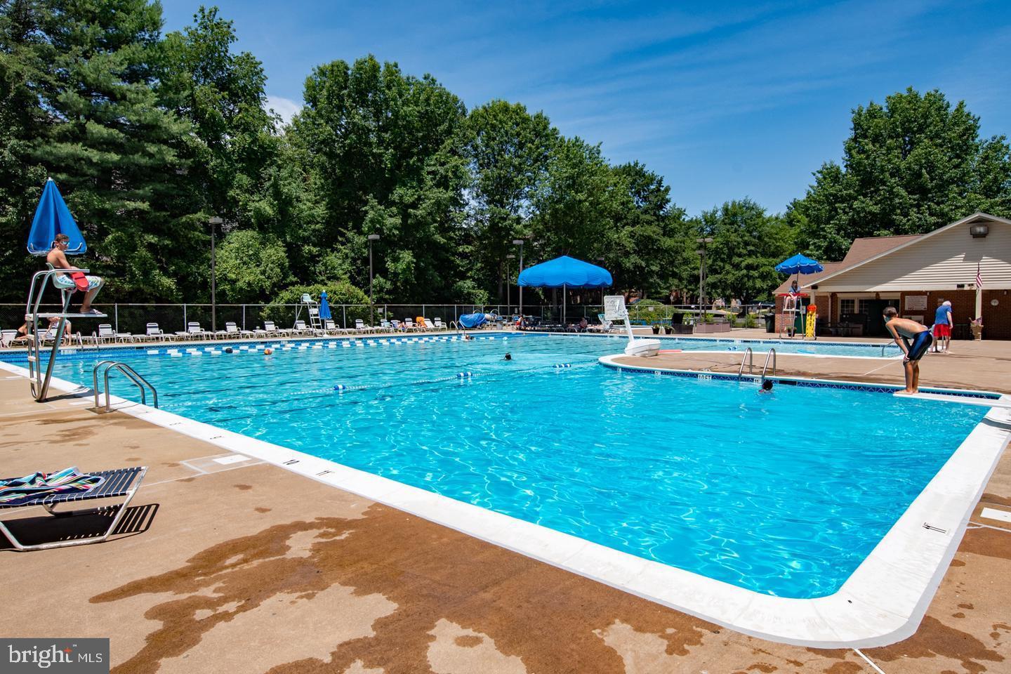 9013 Brook Ford Road Burke, VA 22015 - Photo 27 of 28 a view of a swimming pool with a patio
