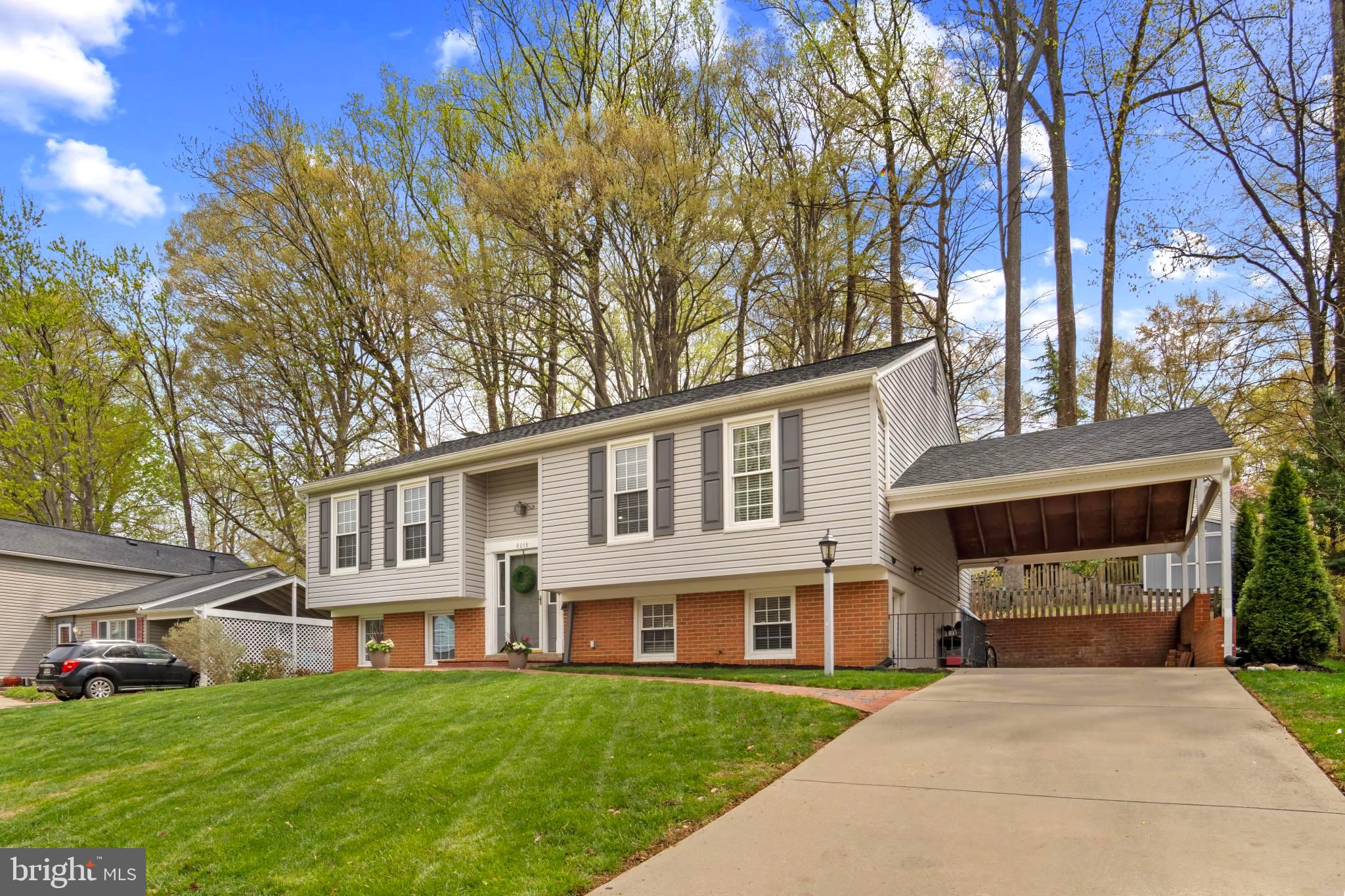 9013 Brook Ford Road Burke, VA 22015 - Photo 4 of 28 a front view of a house with garden