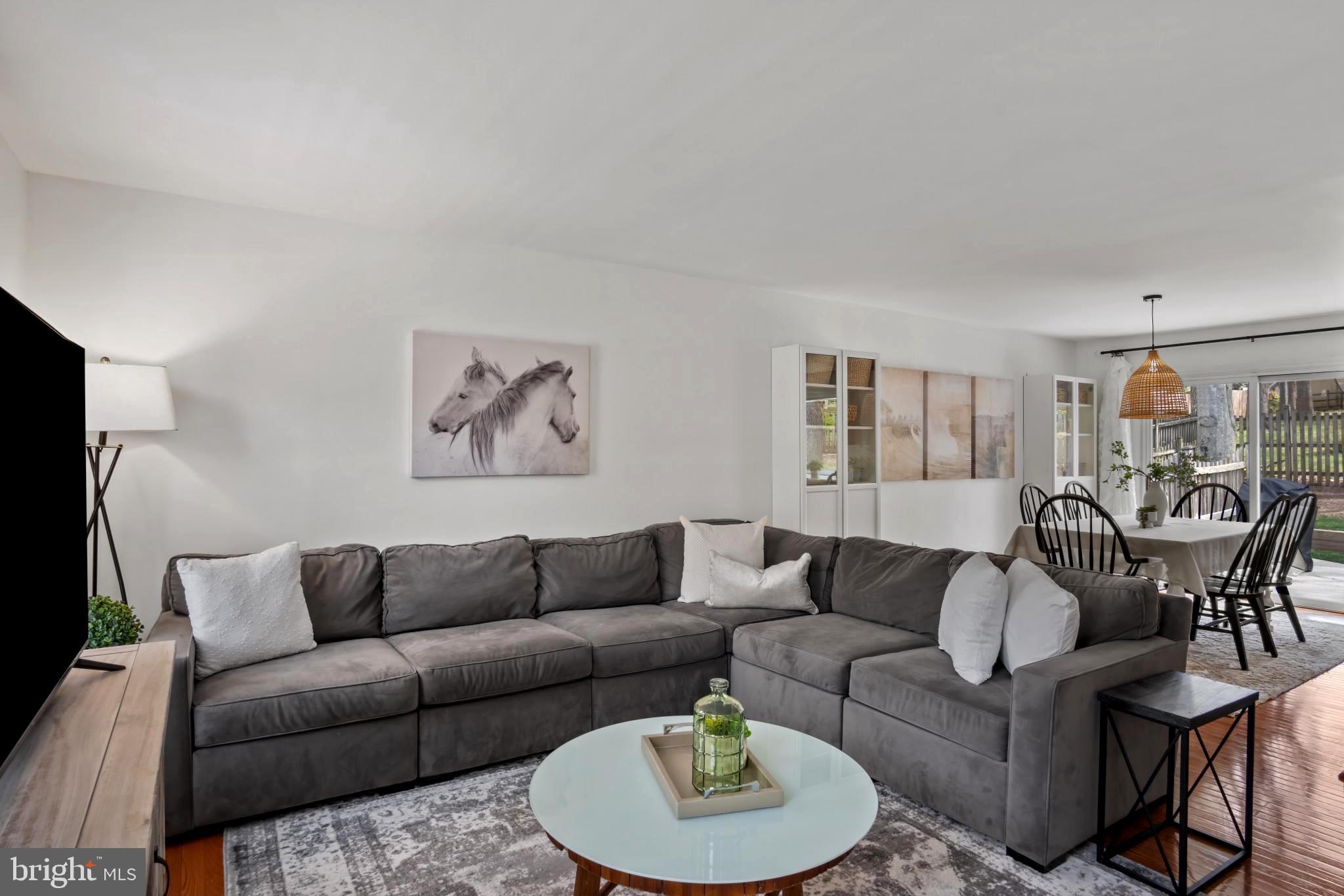 9013 Brook Ford Road Burke, VA 22015 - Photo 7 of 28 a living room with furniture a rug and a table