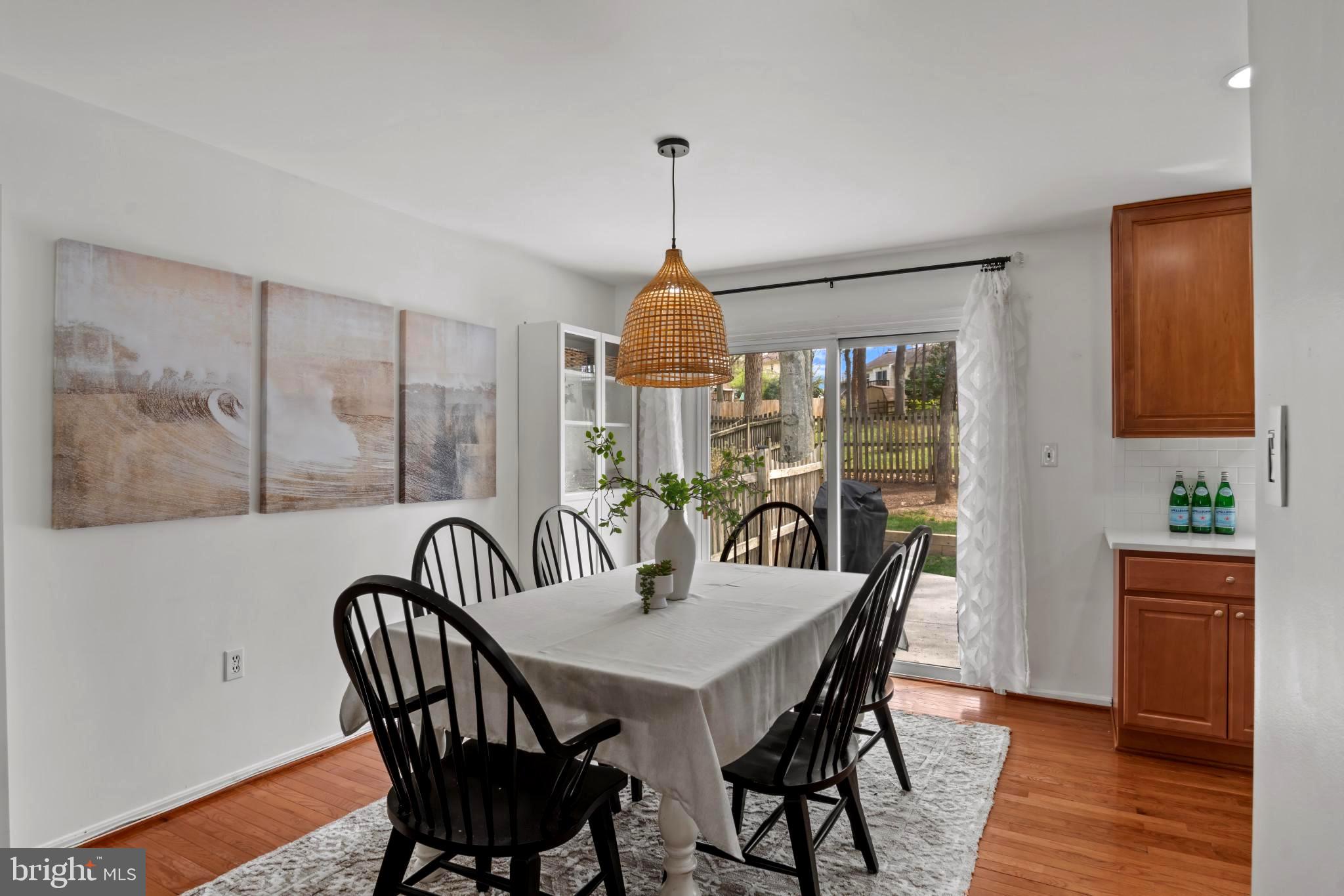 9013 Brook Ford Road Burke, VA 22015 - Photo 8 of 28 a dining room with furniture window and wooden floor