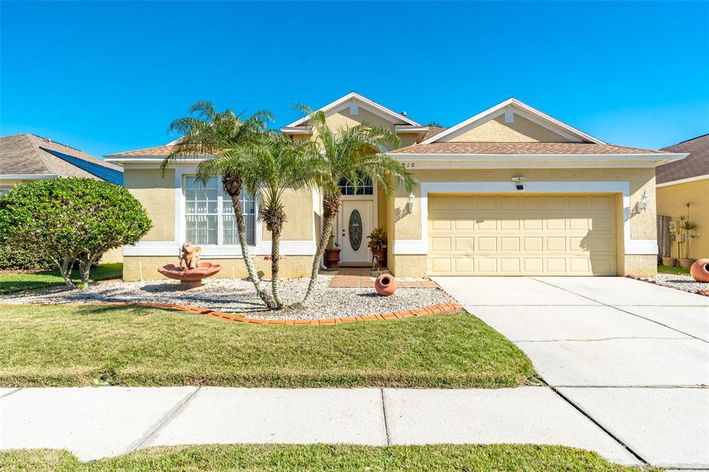 1910 Sedgefield Street Brandon, FL 33511 - Photo 1 of 1 a front view of a house with garden