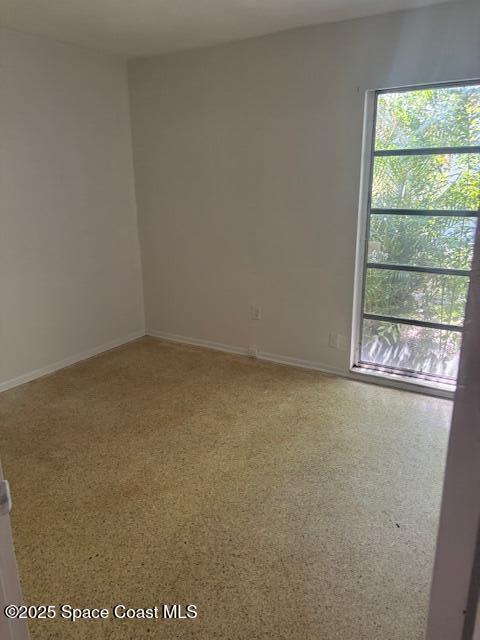 919 Darwin Lane Northeast Palm Bay, FL 32905 - Photo 14 of 14 an empty room with a window