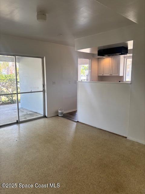 919 Darwin Lane Northeast Palm Bay, FL 32905 - Photo 3 of 14 an empty room with a empty space and window