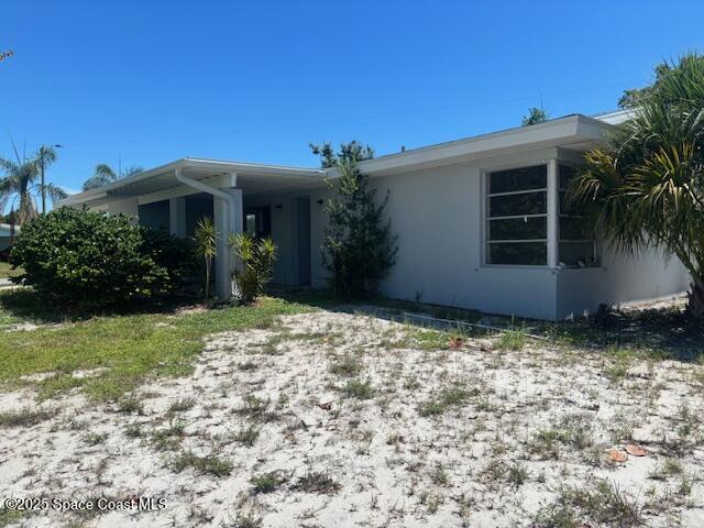 919 Darwin Lane Northeast Palm Bay, FL 32905 - Photo 6 of 14 a house with trees in front of it