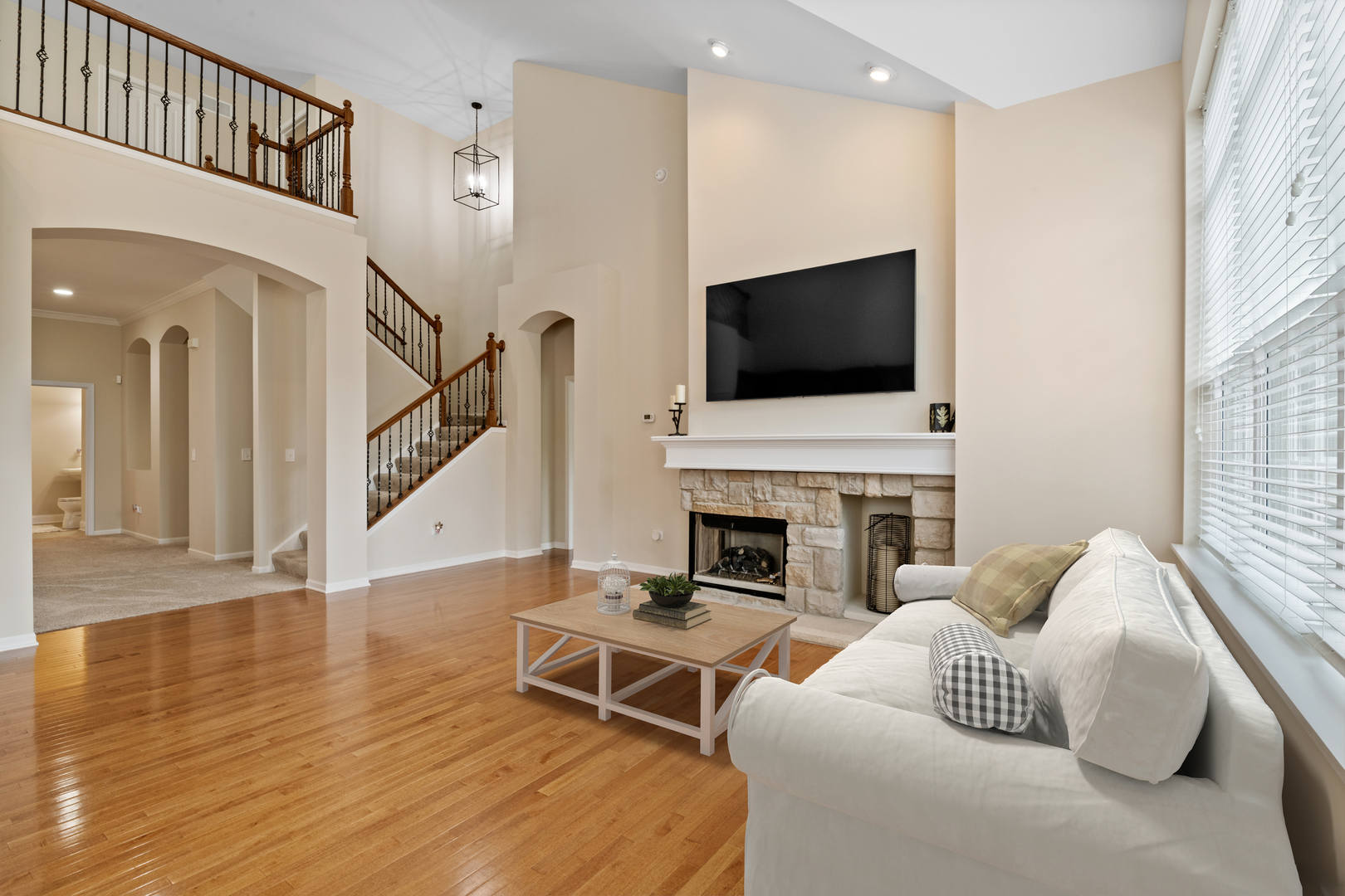 1659 Briarheath Drive Aurora, IL 60505 - Photo 11 of 29 a living room with furniture a fireplace and a flat screen tv