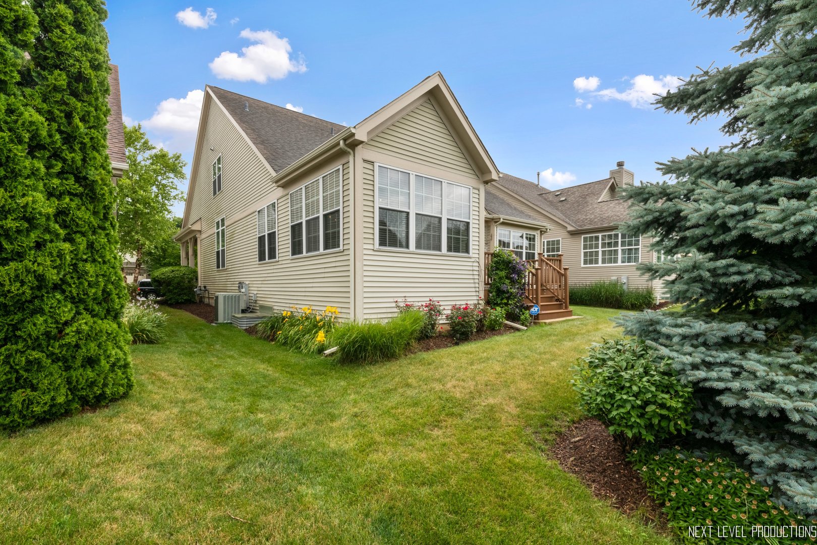 1659 Briarheath Drive Aurora, IL 60505 - Photo 25 of 29 a front view of a house with a garden