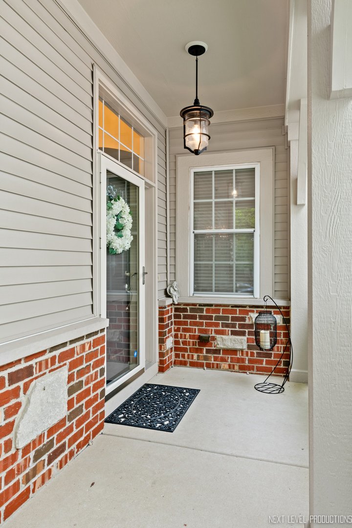 1659 Briarheath Drive Aurora, IL 60505 - Photo 3 of 29 a view of front door with wooden floor
