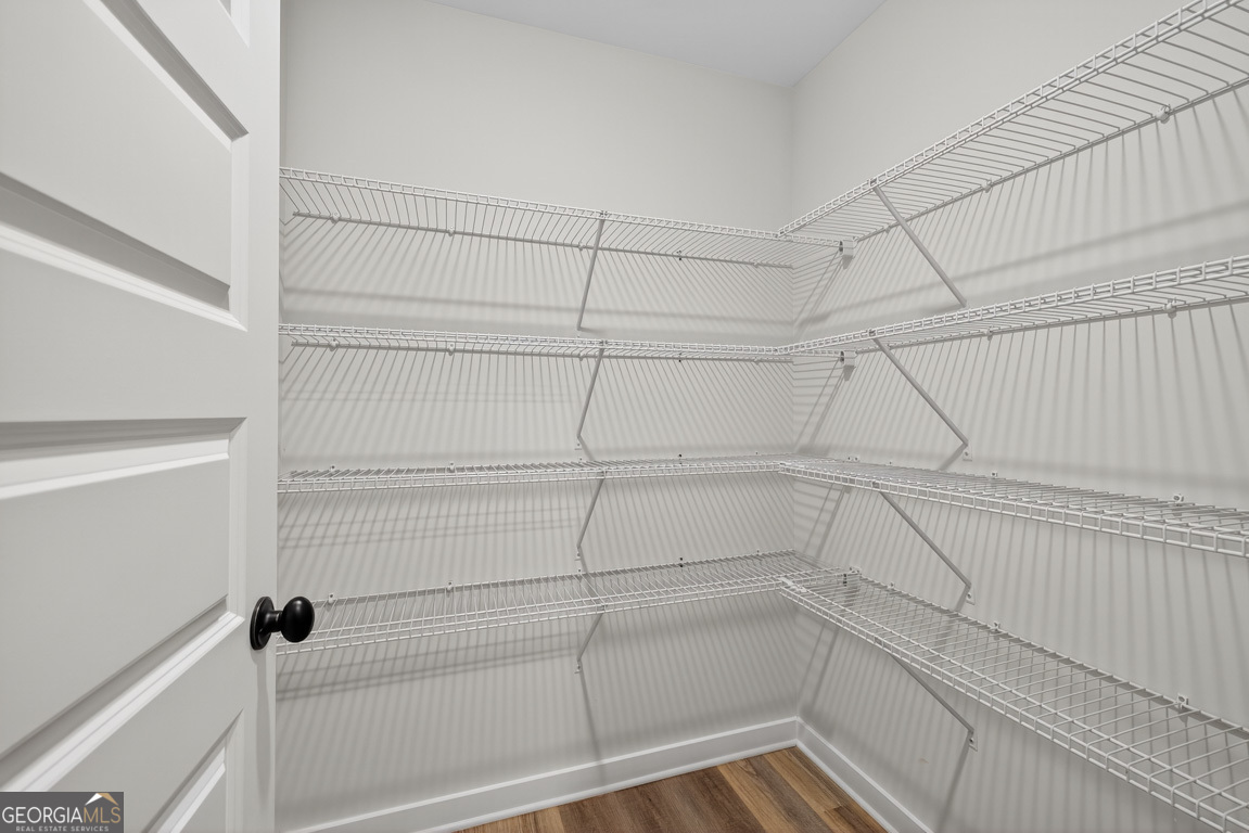 77 Sugar Maple Way, Unit 44 Colbert, GA 30628 - Photo 13 of 30 a view of a room with racks on the wall