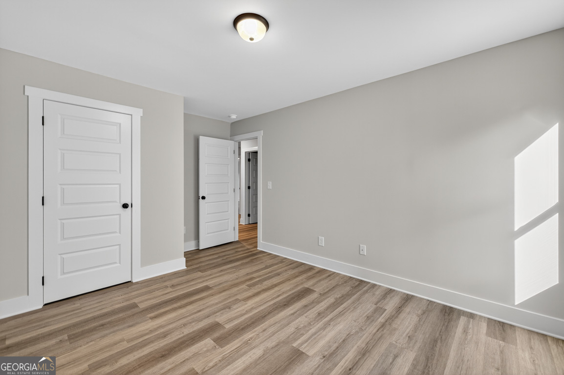 77 Sugar Maple Way, Unit 44 Colbert, GA 30628 - Photo 19 of 30 wooden floor in an empty room