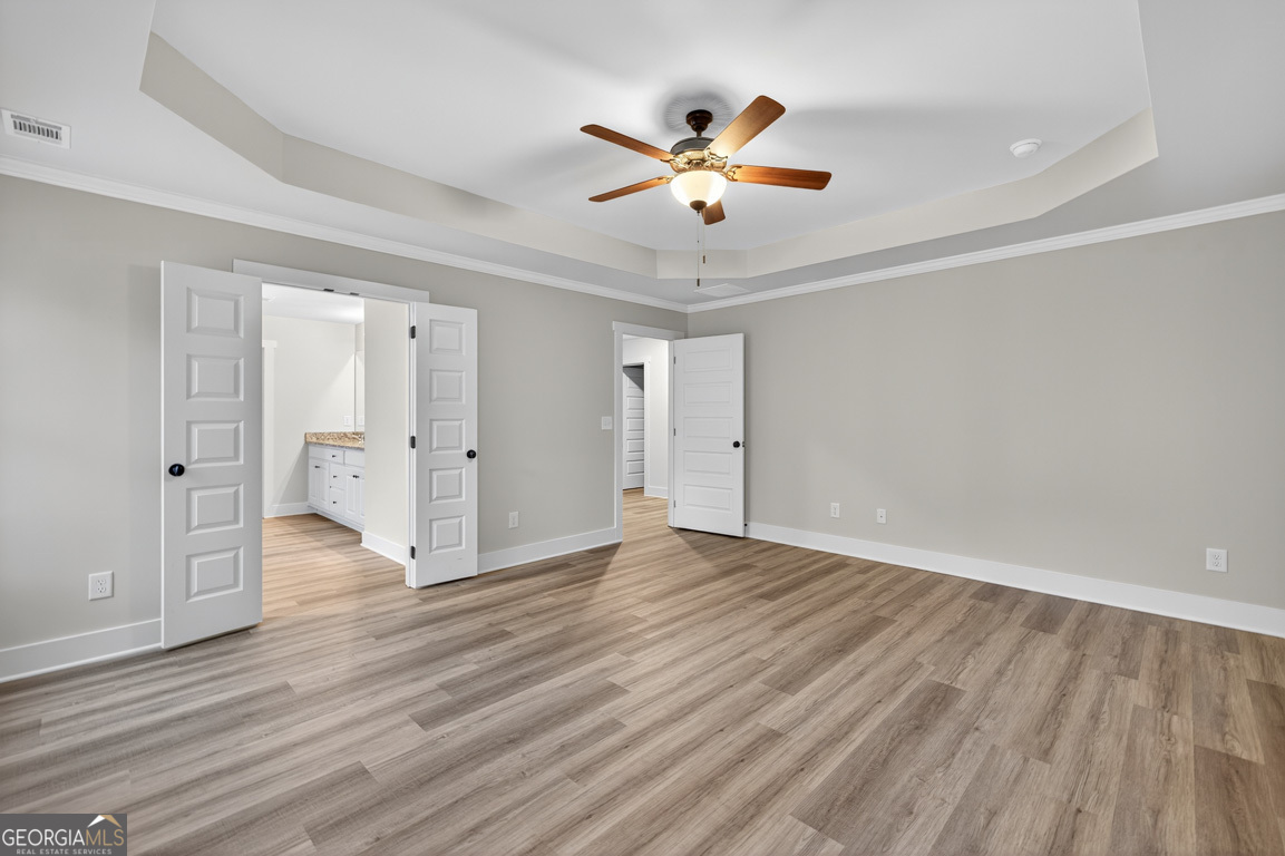 77 Sugar Maple Way, Unit 44 Colbert, GA 30628 - Photo 23 of 30 a view of an empty room and wooden floor