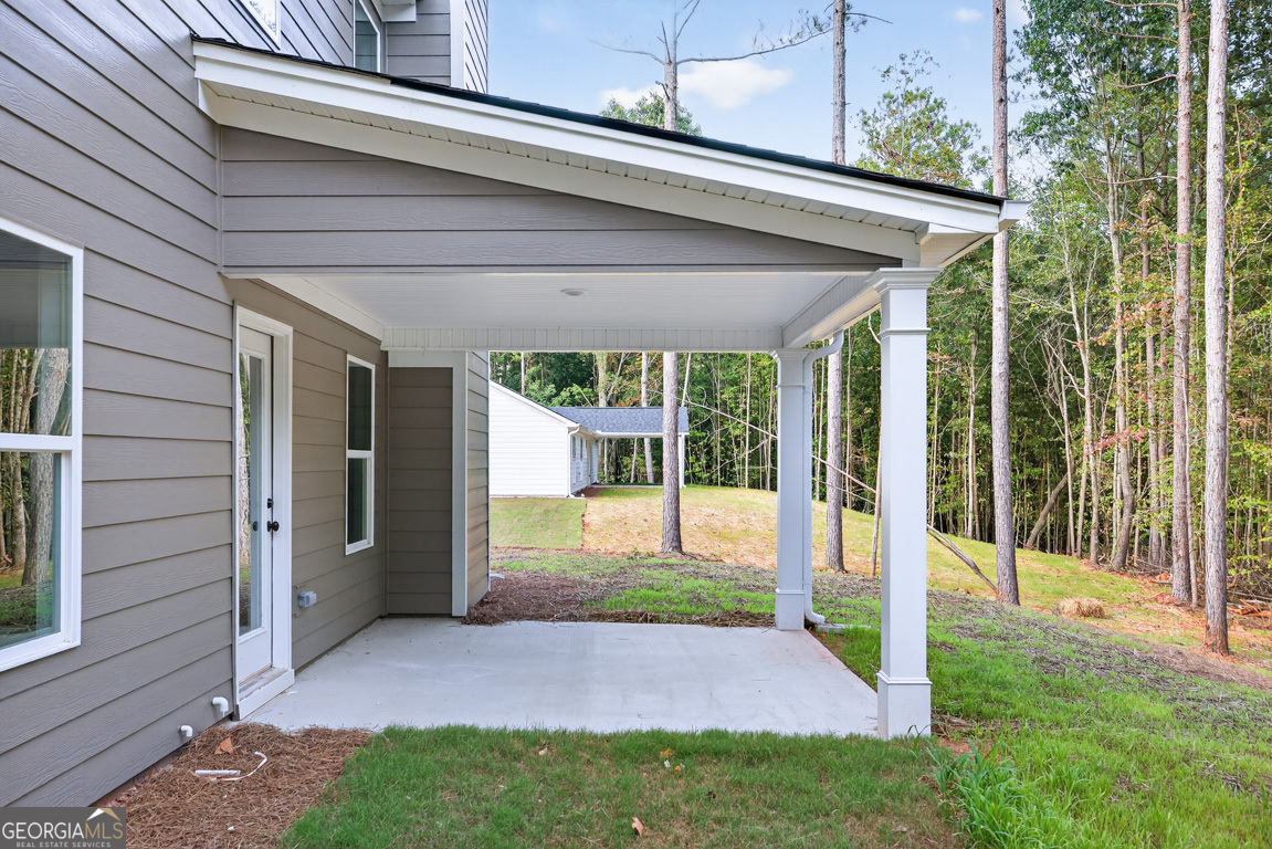 77 Sugar Maple Way, Unit 44 Colbert, GA 30628 - Photo 3 of 30 a view of a porch with a backyard