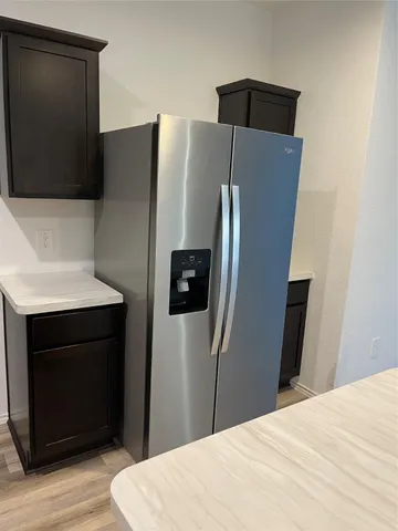 a bedroom with a bed and a television