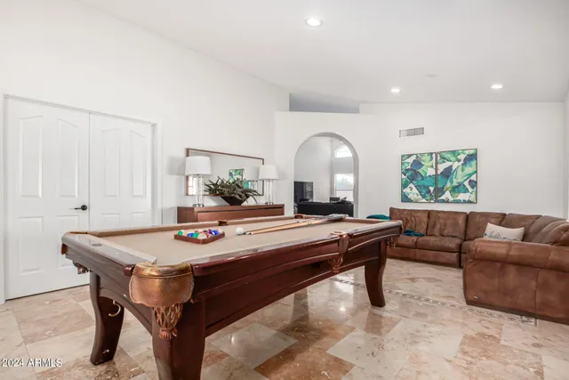 a living room with furniture and a table