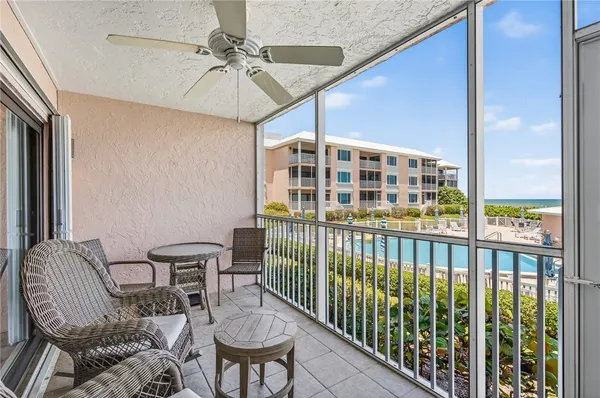 a view of a balcony with furniture
