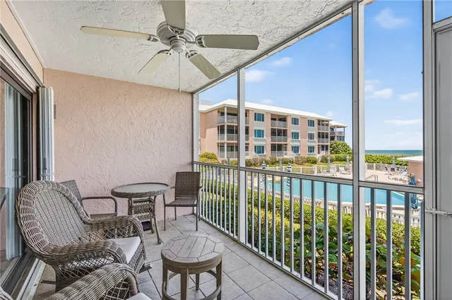 a view of a balcony with furniture