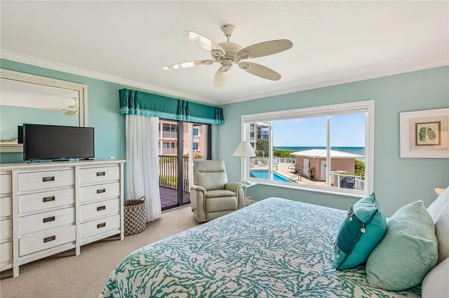 a bedroom with furniture and a flat screen tv