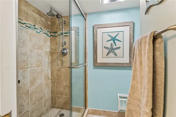 a bathroom with a shower and a toilet