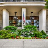 a front view of a house with a garden