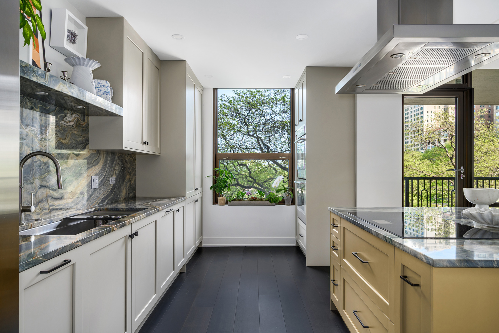 1040 North Lake Shore Drive, Unit 4A Chicago, IL 60611 - Photo 15 of 43 a kitchen with stainless steel appliances a sink stove and cabinets