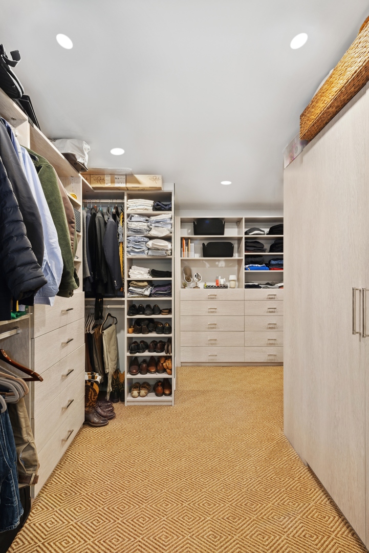 1040 North Lake Shore Drive, Unit 4A Chicago, IL 60611 - Photo 30 of 43 a view of walk in closet with clothes and shoes