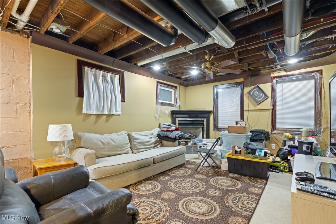 4512 Grayton Road Cleveland, OH 44135 - Photo 18 of 26 Basement featuring ceiling fan and a fireplace