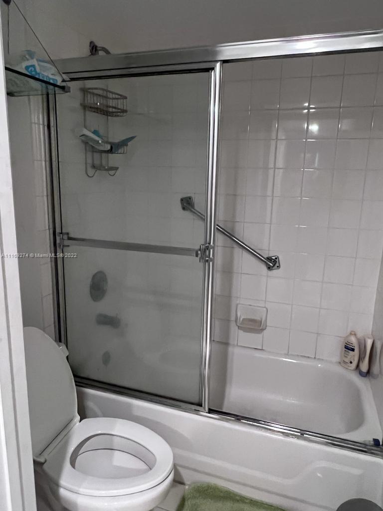 2351 Douglas Road, Unit 908 Miami, FL 33145 - Photo 11 of 17 a bathroom with a toilet and a shower