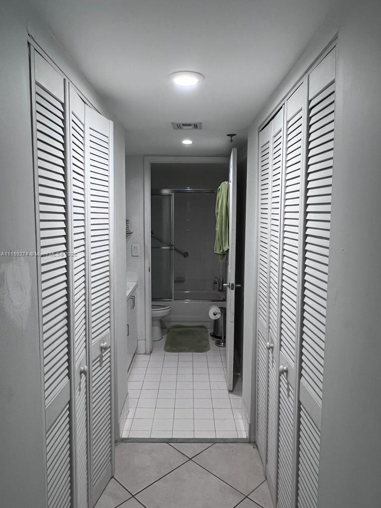2351 Douglas Road, Unit 908 Miami, FL 33145 - Photo 13 of 17 a bathroom with a bathtub and a shower