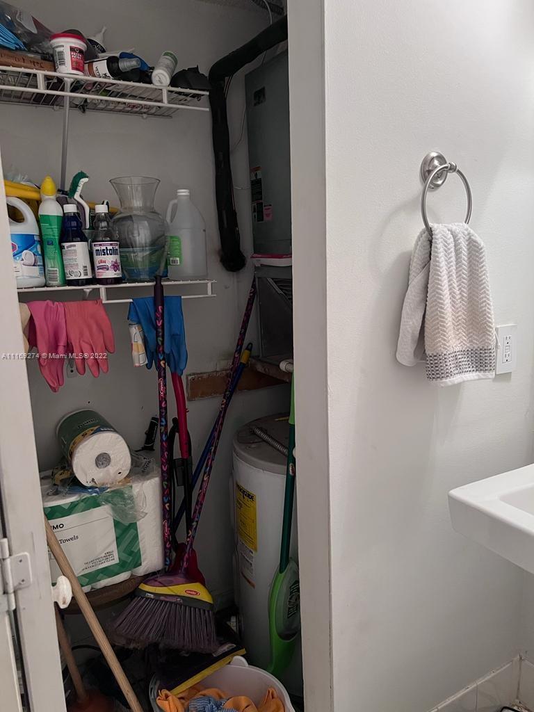 2351 Douglas Road, Unit 908 Miami, FL 33145 - Photo 16 of 17 a bathroom with a toilet shower and mirror