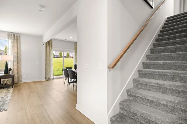 a view of entryway with furniture and wooden floor