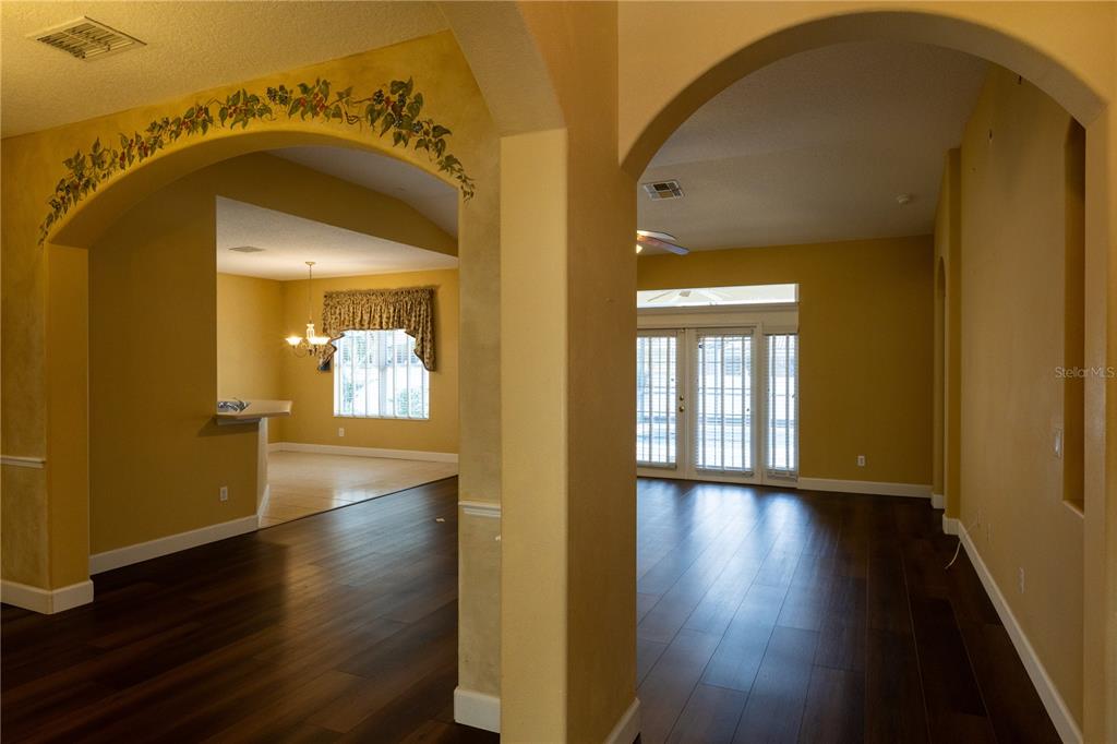 65 Calliope Street Ocoee, FL 34761 - Photo 8 of 60 a view of a hallway with wooden floor