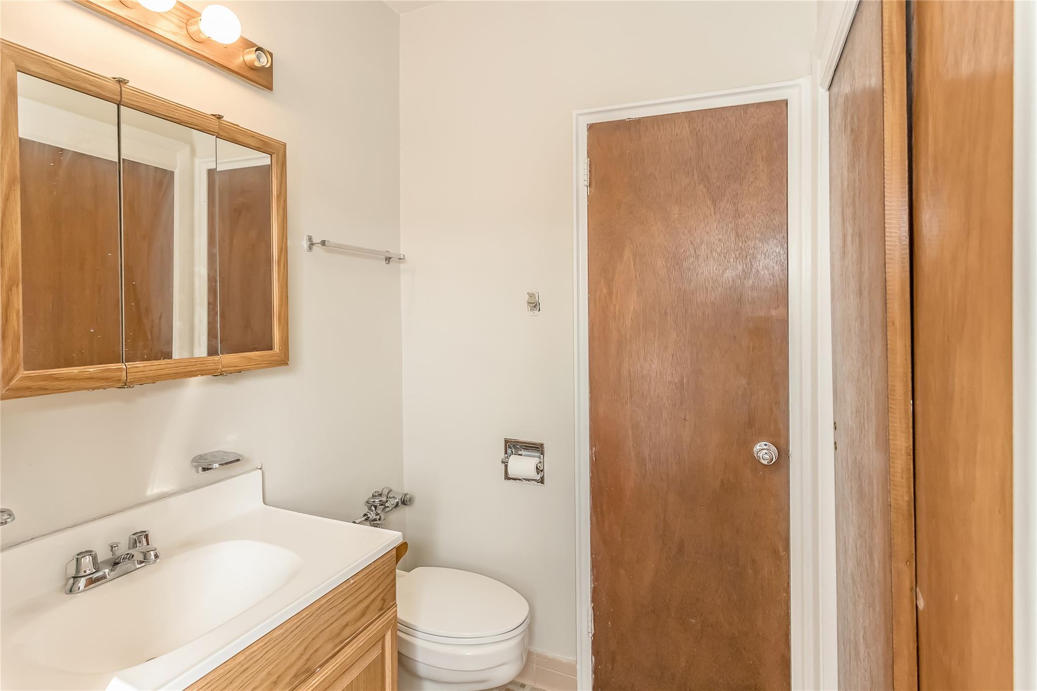 32-22 92nd Street, Unit 603 Queens, NY 11369 - Photo 19 of 25 a bathroom with a sink a toilet and shower