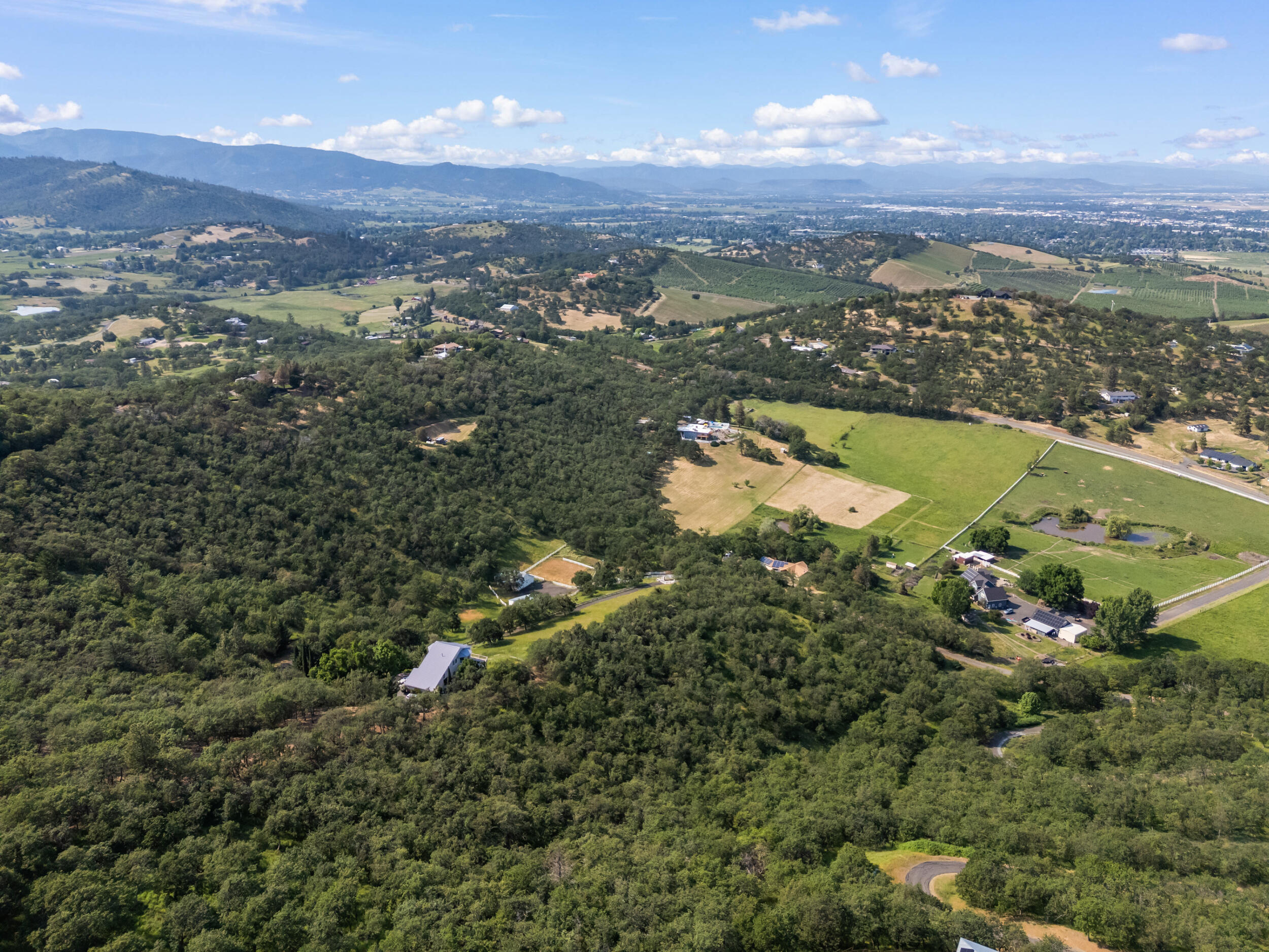 Pioneer Road Medford, OR 97501 - Photo 2 of 15 a view of a city with mountains in the background