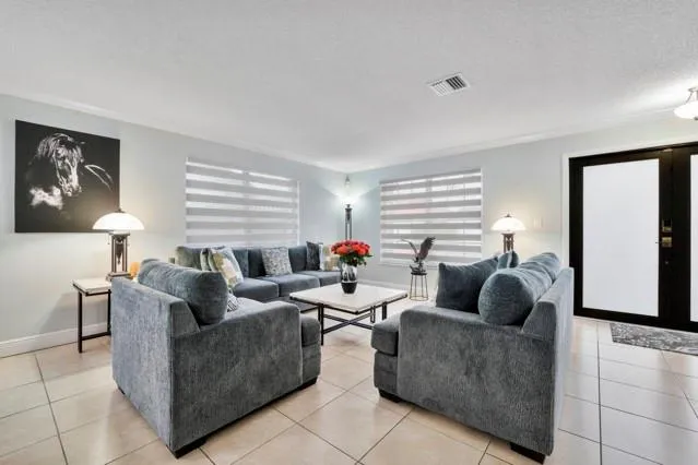 a view of livingroom and dining room with furniture