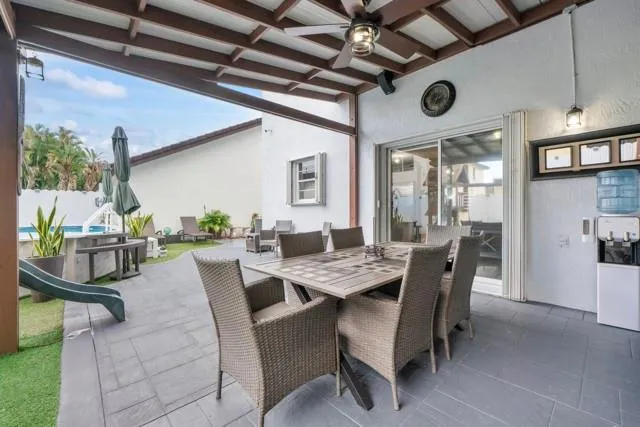 a spacious bedroom with a bed and a couch