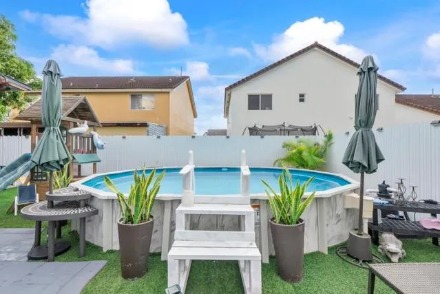 a bathroom with a double vanity sink a mirror and a shower