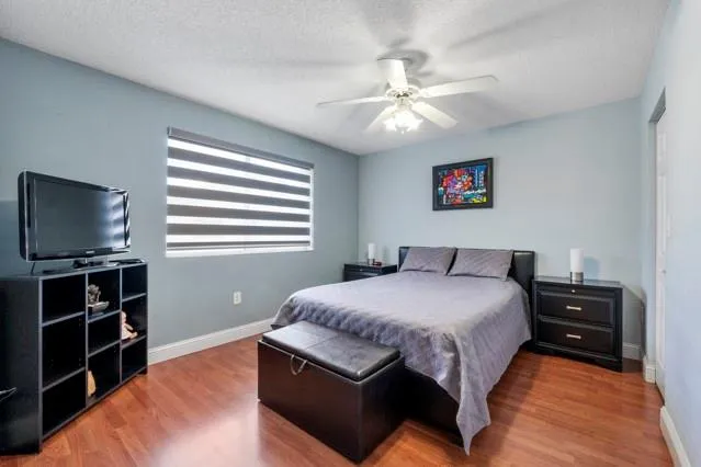 a view of a livingroom with furniture and hardwood floor