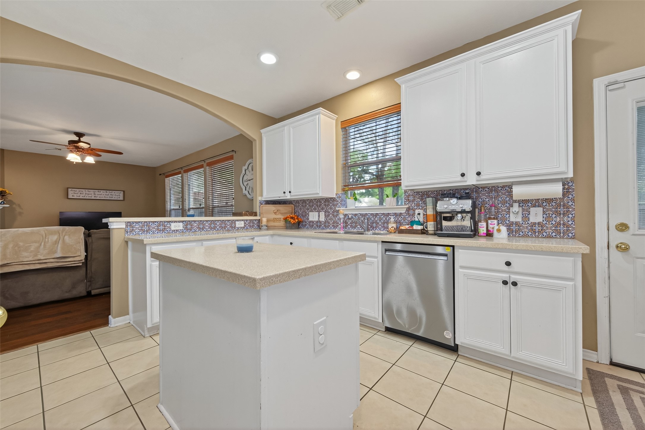 59 Genesee Ridge Drive Conroe, TX 77385 - Photo 19 of 44 a kitchen with a sink window and cabinets
