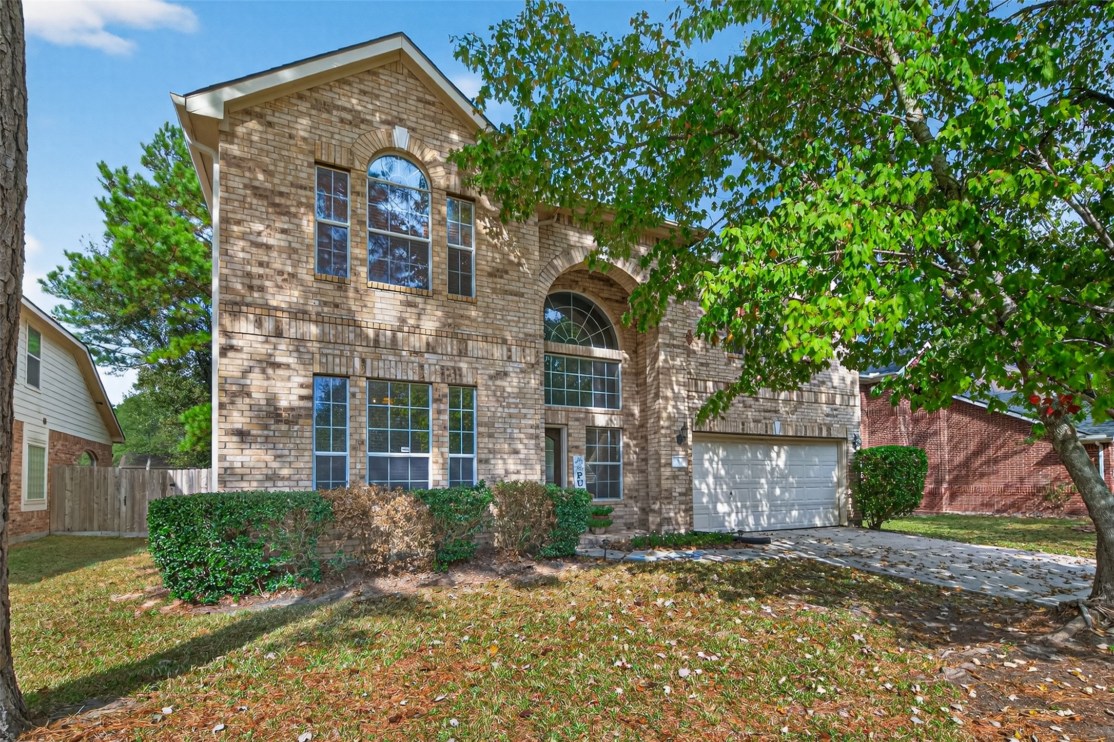 59 Genesee Ridge Drive Conroe, TX 77385 - Photo 2 of 44 a front view of a house with a yard