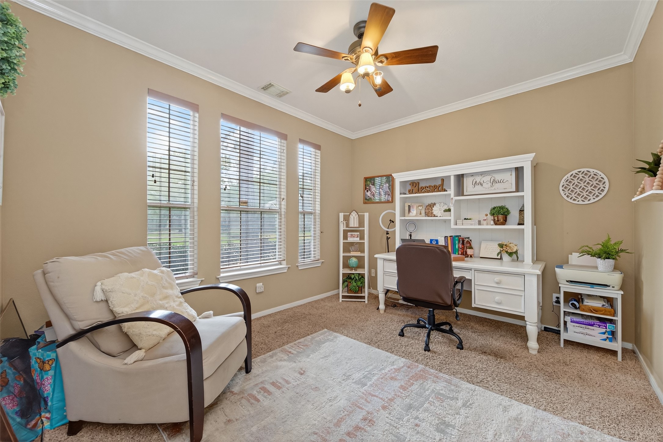 59 Genesee Ridge Drive Conroe, TX 77385 - Photo 21 of 44 a view of a livingroom with workspace and a window
