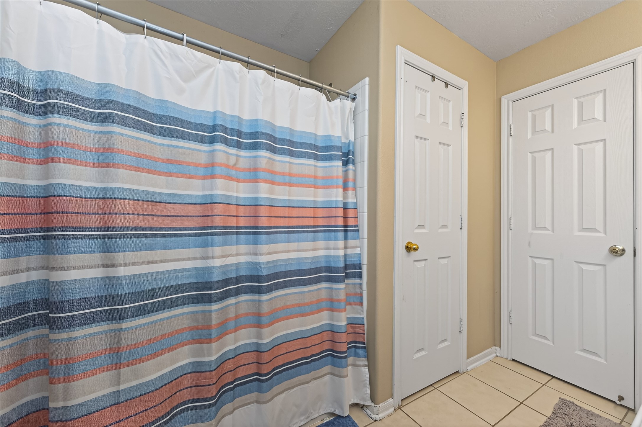 59 Genesee Ridge Drive Conroe, TX 77385 - Photo 26 of 44 a bathroom with a sink and a shower curtain