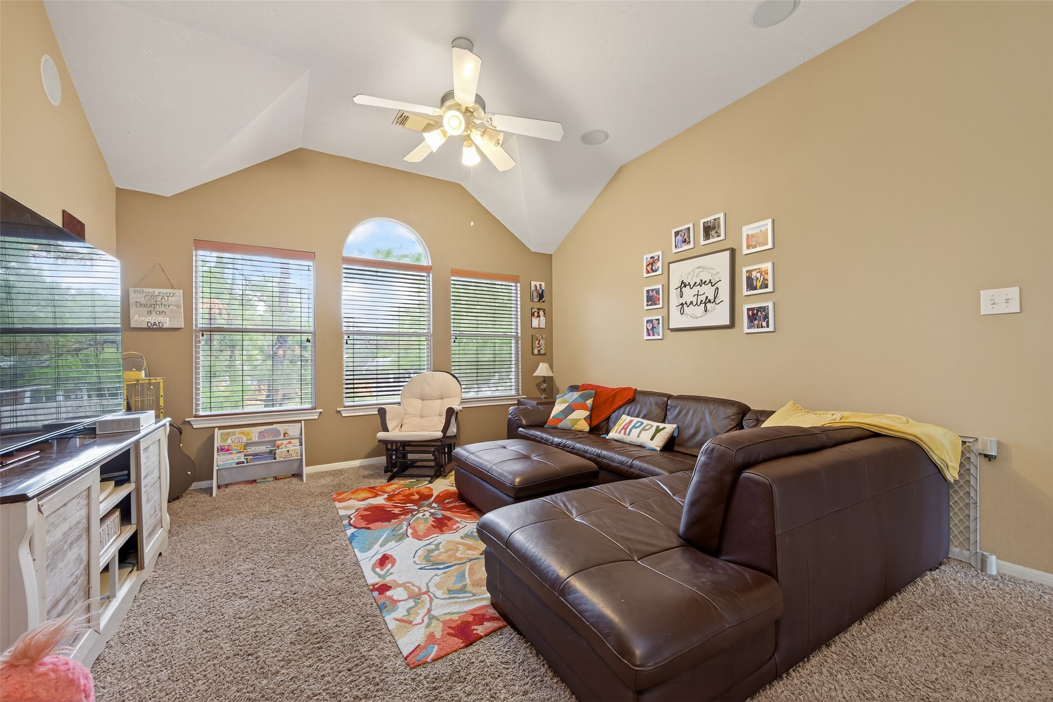 59 Genesee Ridge Drive Conroe, TX 77385 - Photo 29 of 44 a living room with furniture and a large window